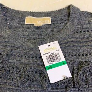 A new without tags fringed sweater by Michael kors in a deep charcoal grey.